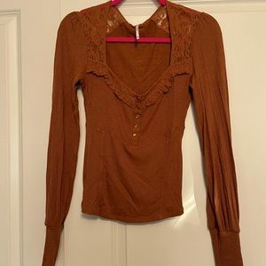 Rustic terracotta cowboy free people blouse.